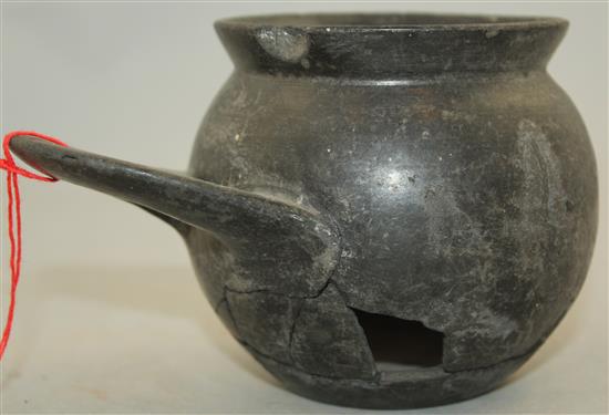 An Etruscan Bucchero ware single handled cup, c. 6th century BC, 9cm, repaired